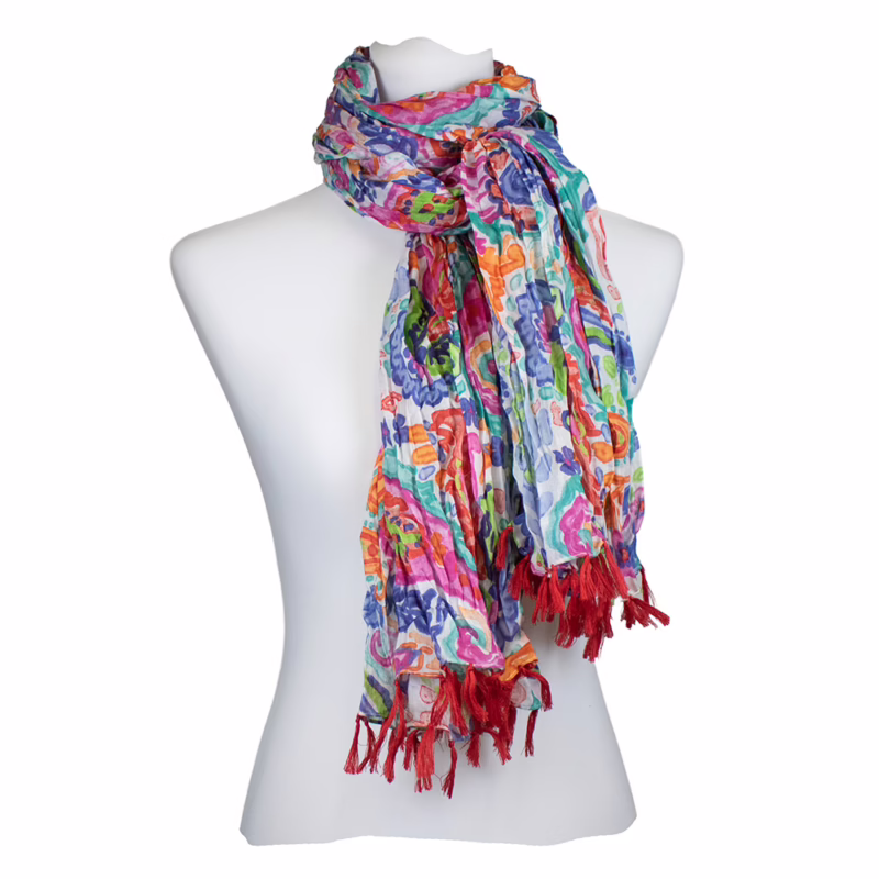 Schal mit buntem Blumenmuster in Blau, Grün, Pink und Orange sowie roten Fransen an den Enden.